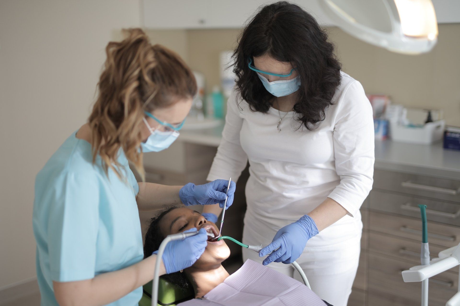 Dental professionals working together during a patient procedure